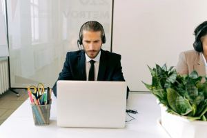 man using business phone - Fireline Broadband symmetric speed