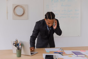 man using business phone - Fireline Broadband codec