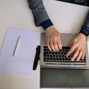 How to Stop Robocalls and Spoofing on Your Business Phone | Fireline Communications person using business phone - Fireline Broadband phone security hosted voip robocalls
