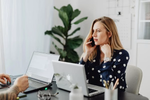 person using business phone - Fireline Broadband phone security hosted voip