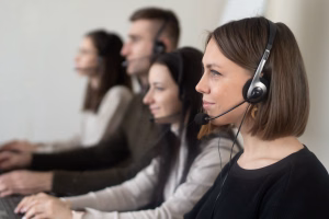 person using business phone - Fireline Broadband phone security hosted voip unified communications